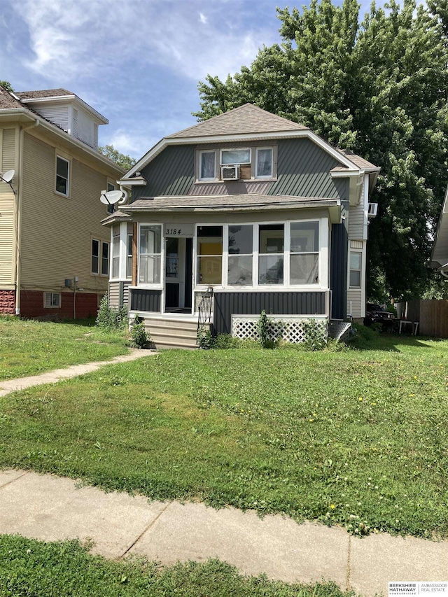 3184 Larimore Ave, Omaha, NE 68111 - bungalow-style house featuring a front lawn and covered porch