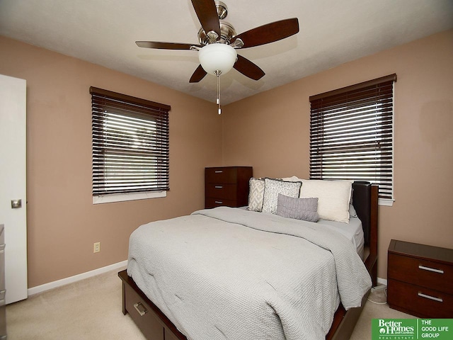 9705 Cady Ave, Omaha, NE 68134 - bedroom with light colored carpet and ceiling fan