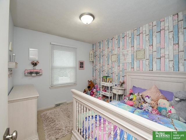 9705 Cady Ave, Omaha, NE 68134 - carpeted bedroom featuring baseboards and an accent wall