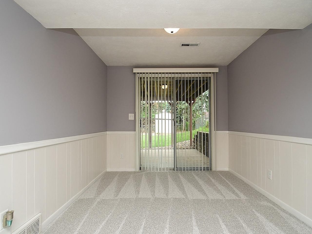 9705 Cady Ave, Omaha, NE 68134 - carpeted spare room featuring a wainscoted wall