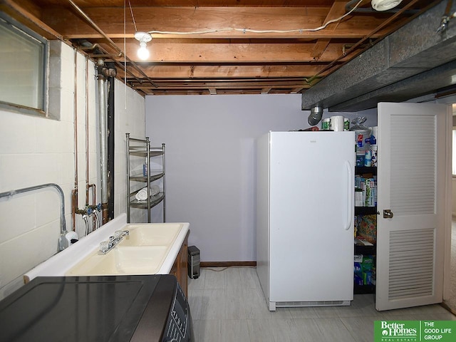 9705 Cady Ave, Omaha, NE 68134 - unfinished below grade area featuring freestanding refrigerator and washer / clothes dryer