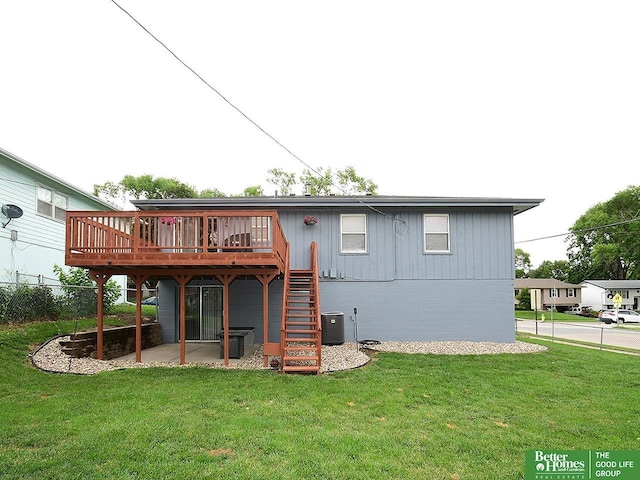 9705 Cady Ave, Omaha, NE 68134 - back of house featuring a wooden deck, stairs, and a yard