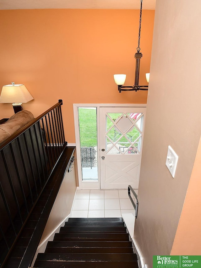 9705 Cady Ave, Omaha, NE 68134 - stairs with tile patterned floors and a chandelier