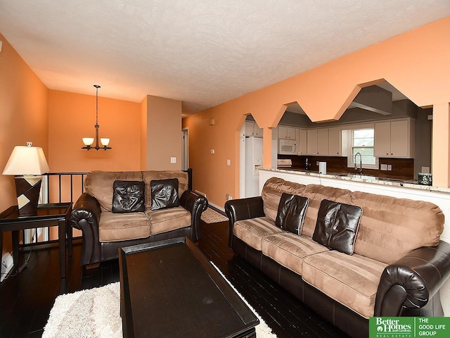 9705 Cady Ave, Omaha, NE 68134 - living room with wood-type flooring and a chandelier