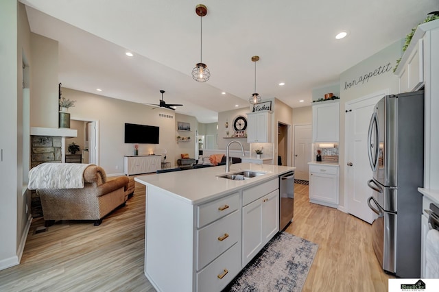 7420 Isidore Dr, Lincoln, NE 68516 - kitchen with appliances with stainless steel finishes, open floor plan, light countertops, light wood-style flooring, and recessed lighting