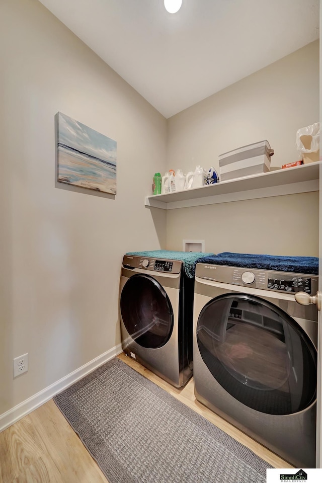 7420 Isidore Dr, Lincoln, NE 68516 - washroom featuring washer and dryer and wood finished floors