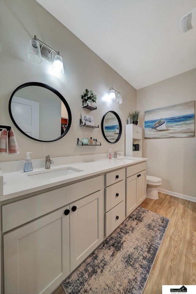 7420 Isidore Dr, Lincoln, NE 68516 - bathroom with double vanity and wood finished floors