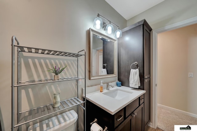 7420 Isidore Dr, Lincoln, NE 68516 - half bathroom featuring vanity and toilet