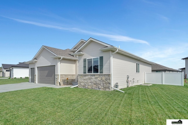 7420 Isidore Dr, Lincoln, NE 68516 - view of front of home with concrete driveway, a garage, and stone siding