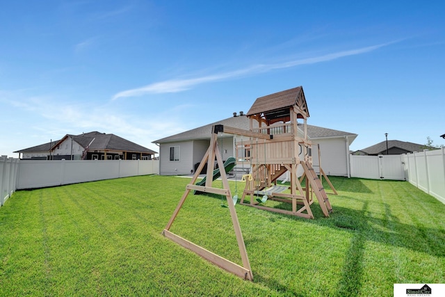 7420 Isidore Dr, Lincoln, NE 68516 - rear view of property with a playground and a fenced backyard