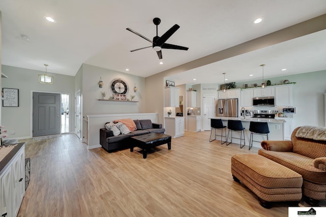 7420 Isidore Dr, Lincoln, NE 68516 - living room with light wood-style floors, ceiling fan, and recessed lighting