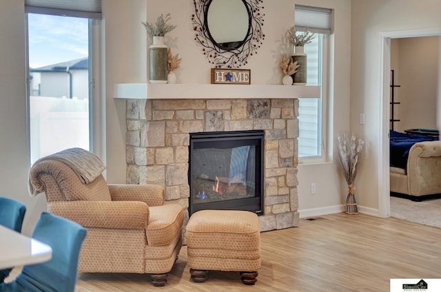 7420 Isidore Dr, Lincoln, NE 68516 - living room featuring wood finished floors and a fireplace
