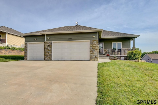3320 Fairway Dr, Plattsmouth, NE 68048 - view of front of home with stone siding, driveway, a front lawn, and a garage