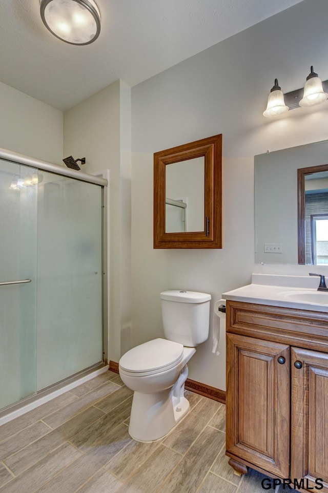 3320 Fairway Dr, Plattsmouth, NE 68048 - full bath featuring a shower stall, wood finish floors, and vanity