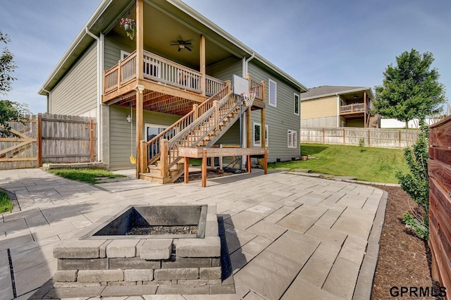 3320 Fairway Dr, Plattsmouth, NE 68048 - rear view of property featuring an outdoor fire pit, stairway, a ceiling fan, a patio area, and a fenced backyard