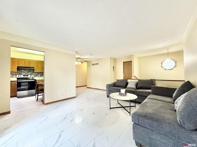 724 W Belmont Ave, Lincoln, NE 68521 - living area featuring light marble finish flooring and ceiling fan
