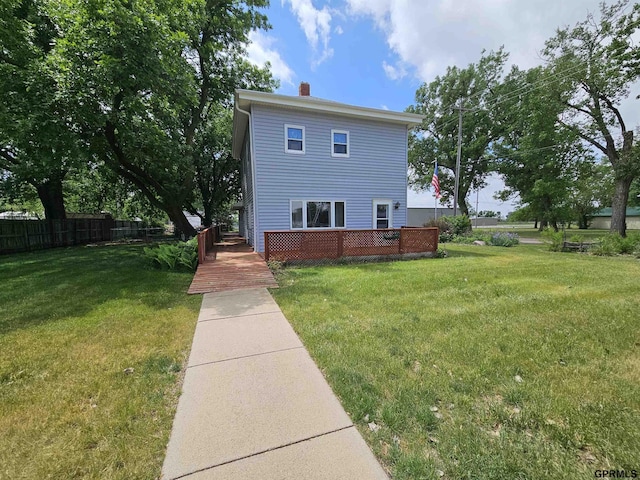 607 4th St, Edgar, NE 68935 - view of front facade featuring a chimney and a wooden deck