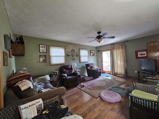 607 4th St, Edgar, NE 68935 - living area featuring ceiling fan, wood finished floors, and a textured ceiling