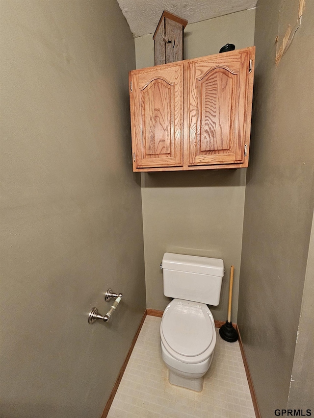 607 4th St, Edgar, NE 68935 - bathroom featuring toilet and tile patterned floors