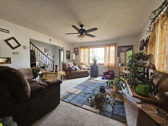 607 4th St, Edgar, NE 68935 - living room with carpet flooring, stairway, a ceiling fan, and a textured ceiling