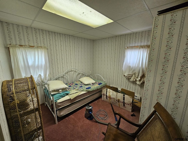 607 4th St, Edgar, NE 68935 - carpeted bedroom with a drop ceiling and wallpapered walls