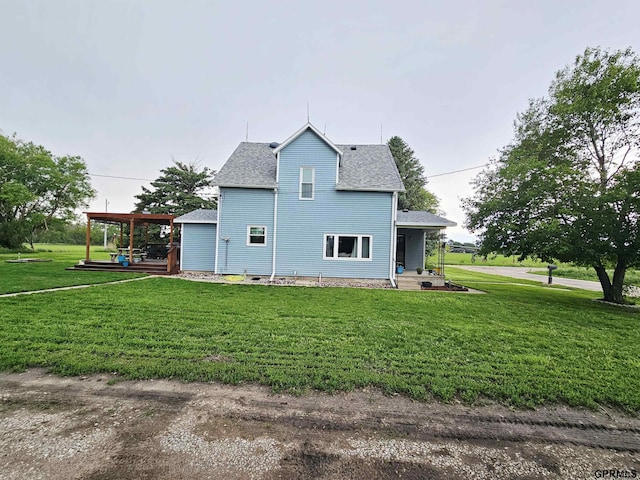 401 Chestnut Ave, Saronville, NE 68975 - view of home's exterior featuring a shingled roof and a lawn