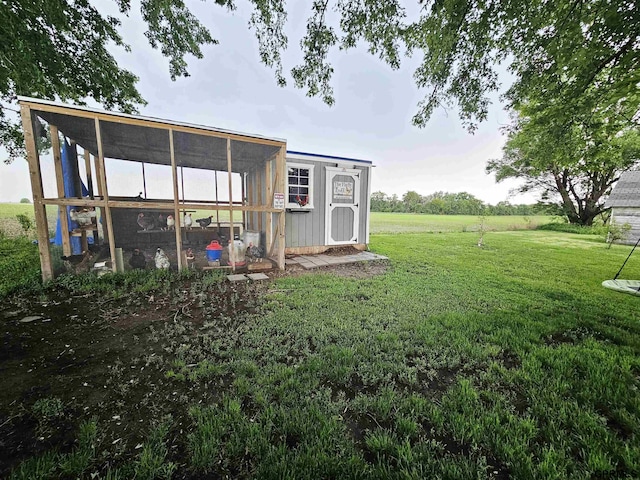 401 Chestnut Ave, Saronville, NE 68975 - view of grassy yard with exterior structure and an outdoor structure