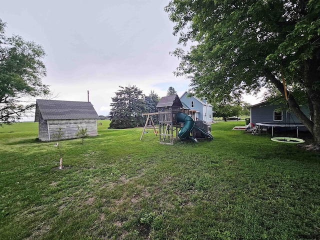 401 Chestnut Ave, Saronville, NE 68975 - view of green lawn with a playground and a storage shed