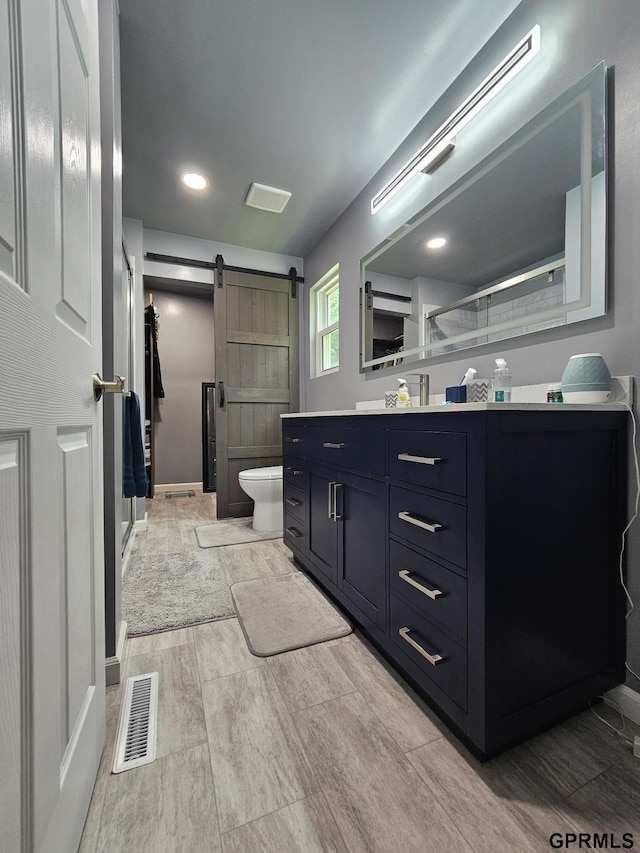 401 Chestnut Ave, Saronville, NE 68975 - bathroom featuring vanity, a shower stall, and wood finish floors