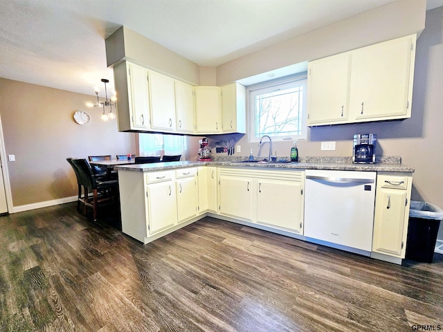 108 W Ridge St, Sutton, NE 68979 - kitchen with dishwasher, dark wood finished floors, a chandelier, light countertops, and a peninsula