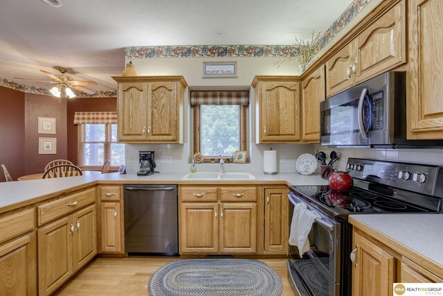 7409 Elk Creek Dr, Lincoln, NE 68516 - kitchen with black electric range oven, dishwasher, stainless steel microwave, and plenty of natural light