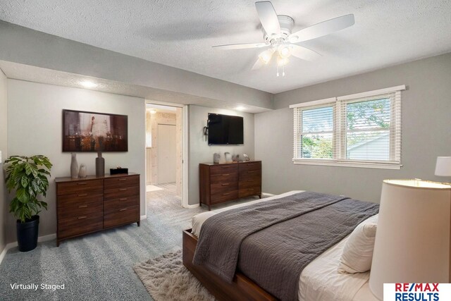 605 S 120th Ave, Omaha, NE 68154 - bedroom with a textured ceiling, carpet, connected bathroom, and ceiling fan
