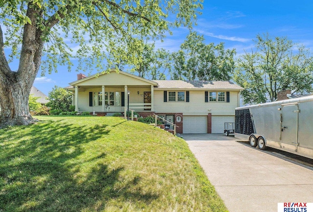 605 S 120th Ave, Omaha, NE 68154 - view of front of property featuring a garage, driveway, a front yard, and brick siding