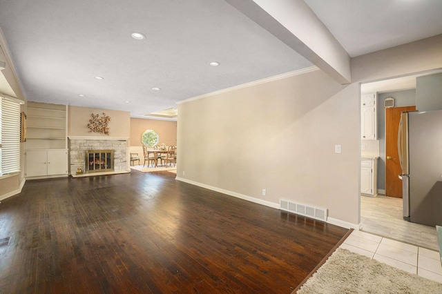 605 S 120th Ave, Omaha, NE 68154 - unfurnished living room with crown molding, recessed lighting, light wood-style floors, and a fireplace