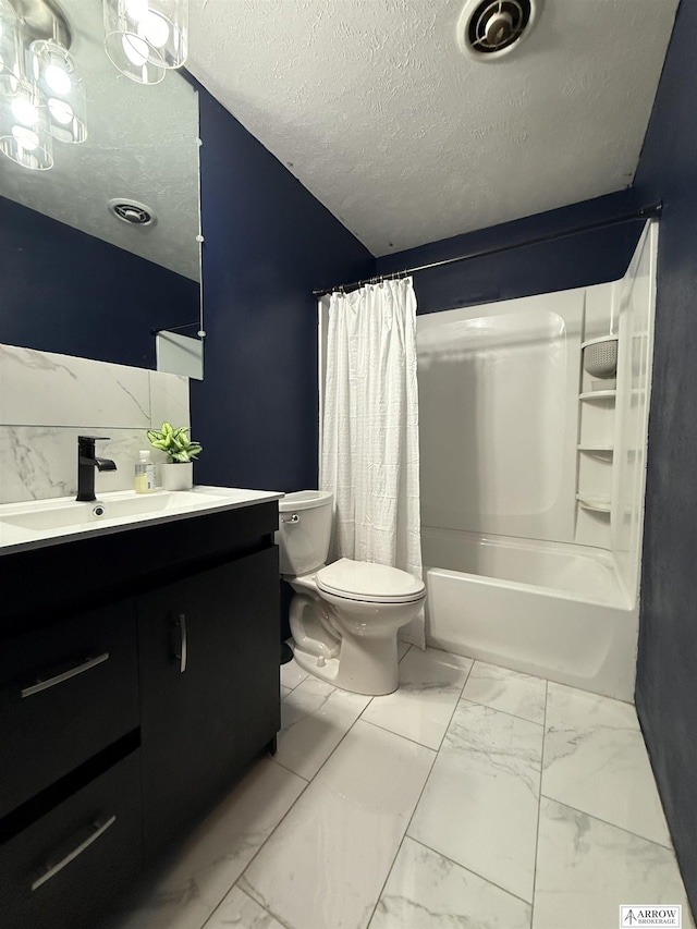 400 W Broadview St, Lincoln, NE 68505 - full bath with marble finish flooring, vanity, shower / bathtub combination with curtain, and a textured ceiling