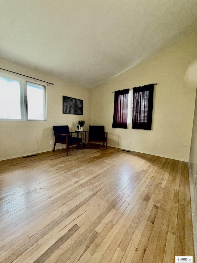 400 W Broadview St, Lincoln, NE 68505 - living area with light wood-style flooring and lofted ceiling