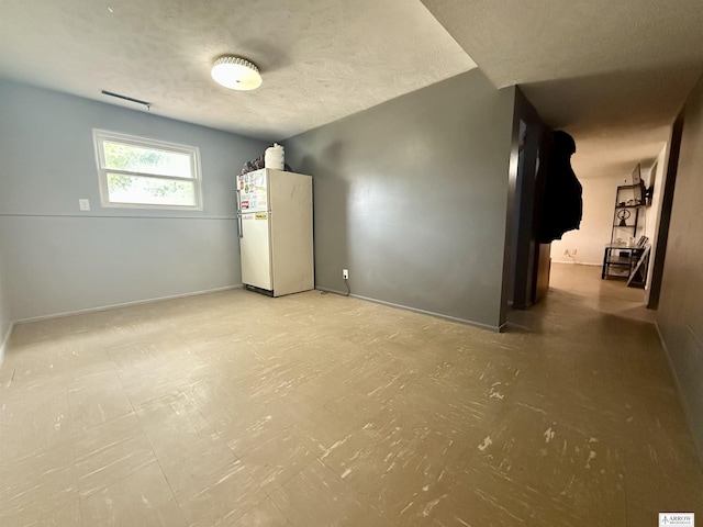 400 W Broadview St, Lincoln, NE 68505 - spare room featuring a textured ceiling and tile patterned floors