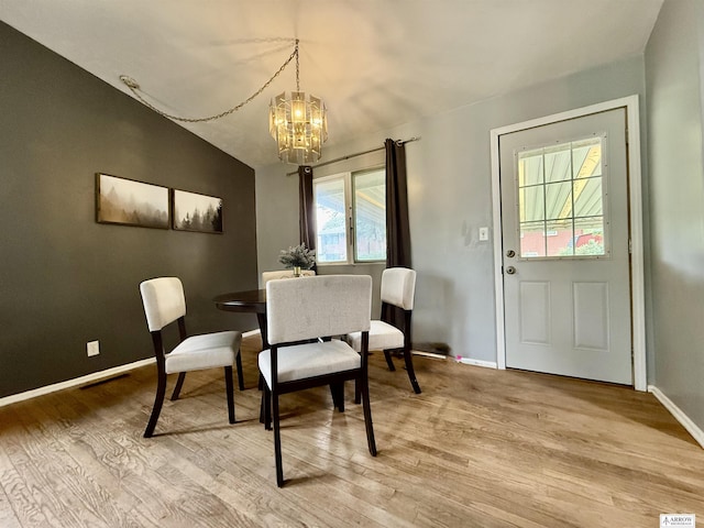 400 W Broadview St, Lincoln, NE 68505 - dining room featuring a chandelier, light wood-style floors, and lofted ceiling