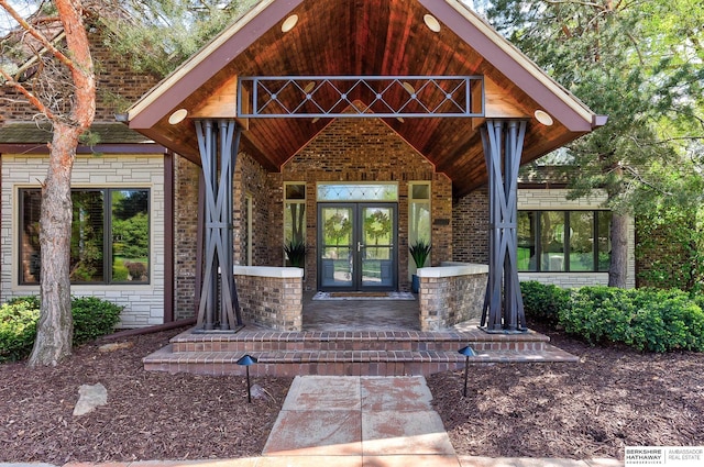14341 Hamilton St, Omaha, NE 68154 - entrance to property featuring covered porch, brick siding, and french doors