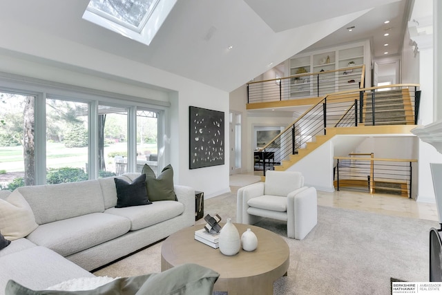 14341 Hamilton St, Omaha, NE 68154 - living area featuring high vaulted ceiling, recessed lighting, stairway, and a skylight
