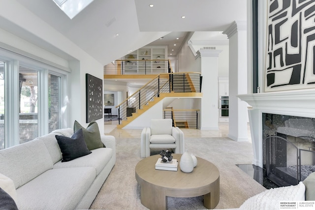 14341 Hamilton St, Omaha, NE 68154 - living area featuring stairway, a high end fireplace, recessed lighting, and a towering ceiling