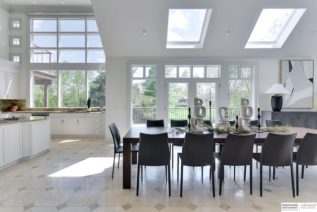 14341 Hamilton St, Omaha, NE 68154 - dining room featuring a skylight, a towering ceiling, and light flooring