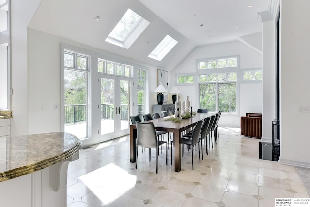 14341 Hamilton St, Omaha, NE 68154 - dining space featuring french doors, a skylight, high vaulted ceiling, and recessed lighting