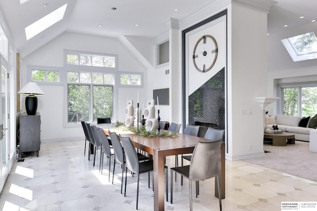14341 Hamilton St, Omaha, NE 68154 - dining room with a skylight, high vaulted ceiling, healthy amount of natural light, and light carpet