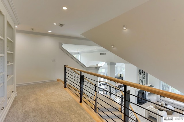 14341 Hamilton St, Omaha, NE 68154 - hall with crown molding, an upstairs landing, recessed lighting, decorative columns, and light carpet
