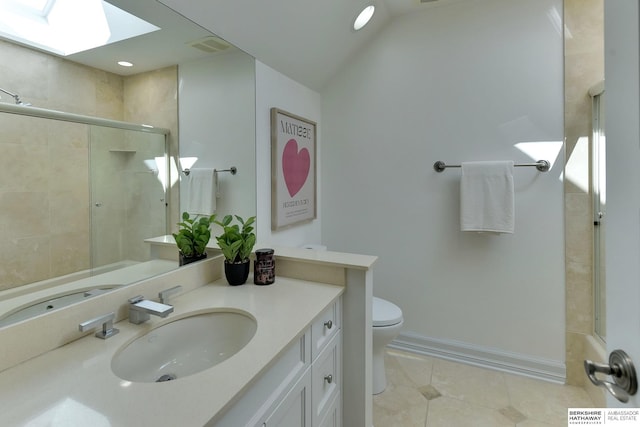 14341 Hamilton St, Omaha, NE 68154 - bathroom with a skylight, tile patterned flooring, vanity, tiled shower, and recessed lighting