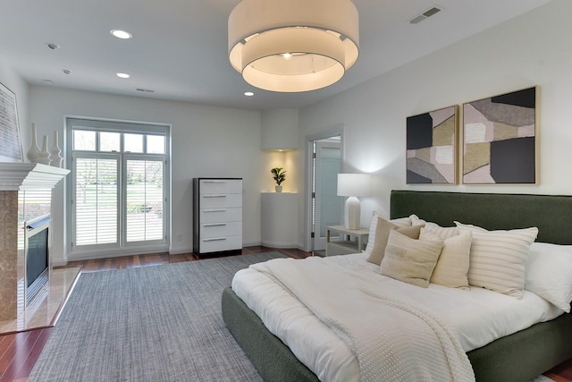14341 Hamilton St, Omaha, NE 68154 - bedroom with wood finished floors, a high end fireplace, and recessed lighting
