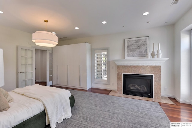 14341 Hamilton St, Omaha, NE 68154 - bedroom featuring wood finished floors, recessed lighting, and a premium fireplace