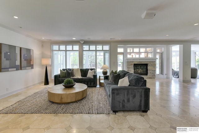 14341 Hamilton St, Omaha, NE 68154 - living area with a stone fireplace, recessed lighting, ornamental molding, and light tile patterned flooring