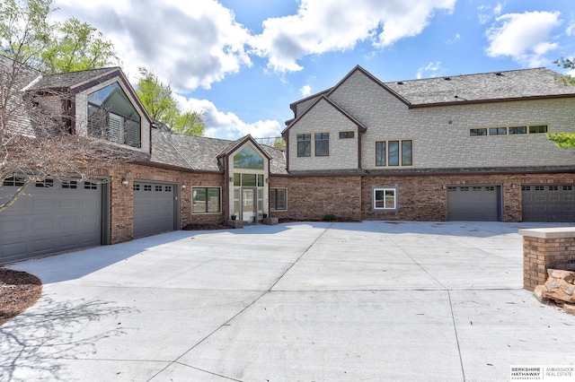 14341 Hamilton St, Omaha, NE 68154 - view of side of property with brick siding and concrete driveway